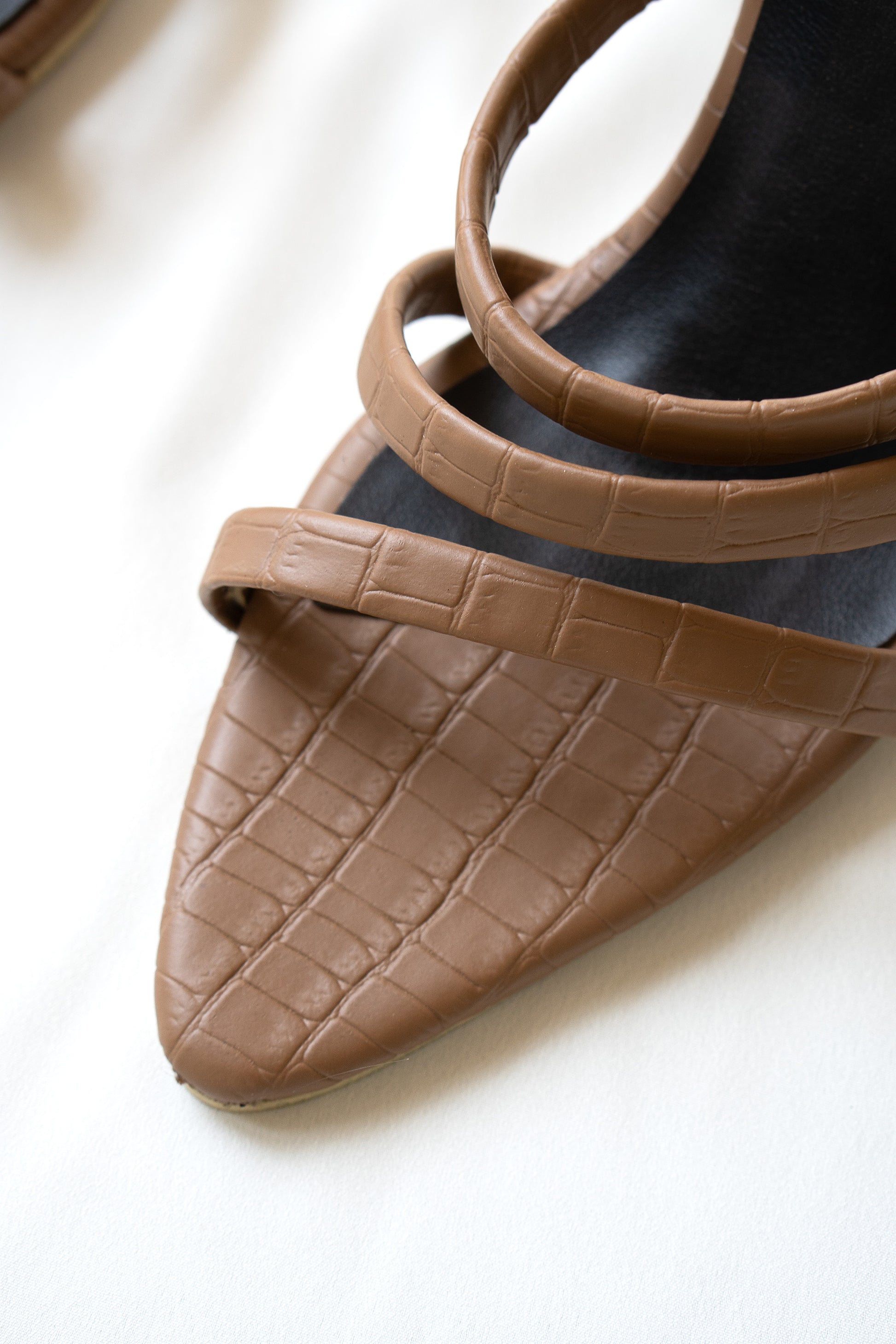 Chic Tan crocodile-print heel with a sleek 3-inch transparent heel