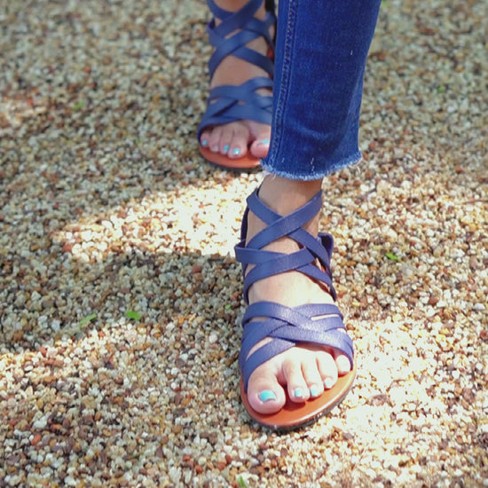 Bold and stylish navy blue gladiator flat sandal for ladies, featuring a convenient zip closure