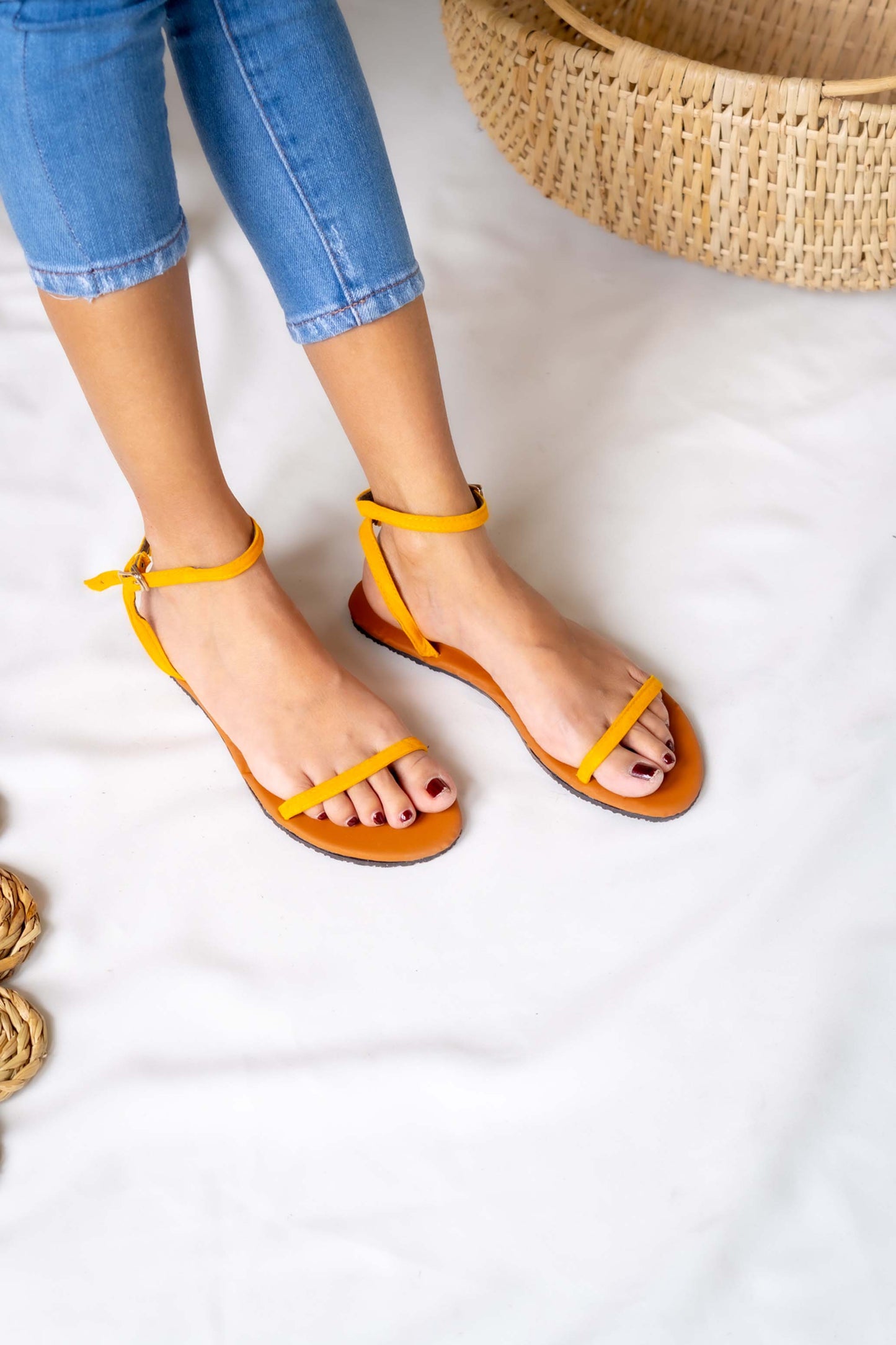 Sunny and stylish, this ladies' yellow flat sandal brings a pop of color to any outfit
